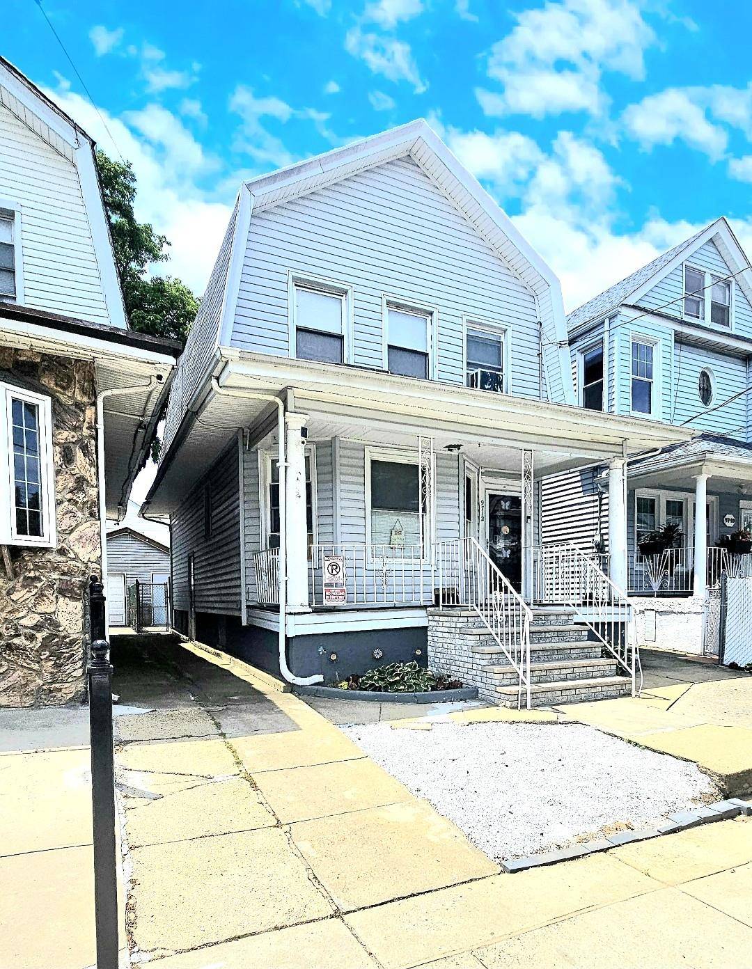 Welcome to 97 12 110th Street, a classic two story single family home that blends timeless charm with unbeatable convenience.