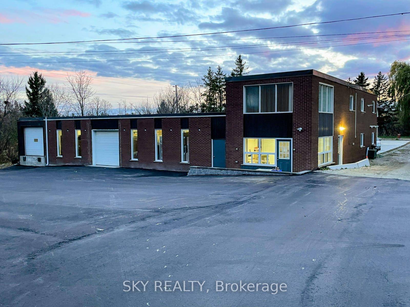 Unique 1 acre property featuring a freestanding 9000 sq ft Commercial industrial Building with an updated 3 bedroom house and 2 bedroom apartment above warehouse.