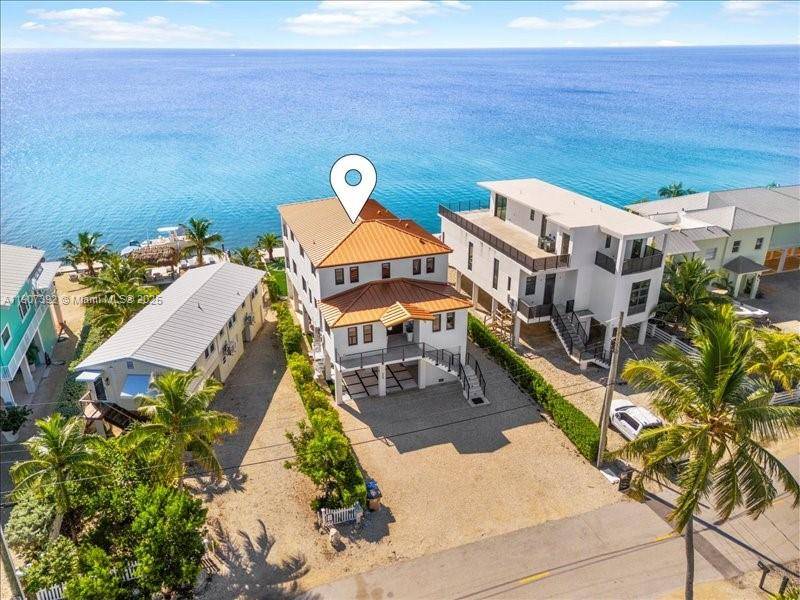 Wake up to endless ocean views at this stunning 5 bedroom, 4 bath waterfront home in the heart of Tavernier.