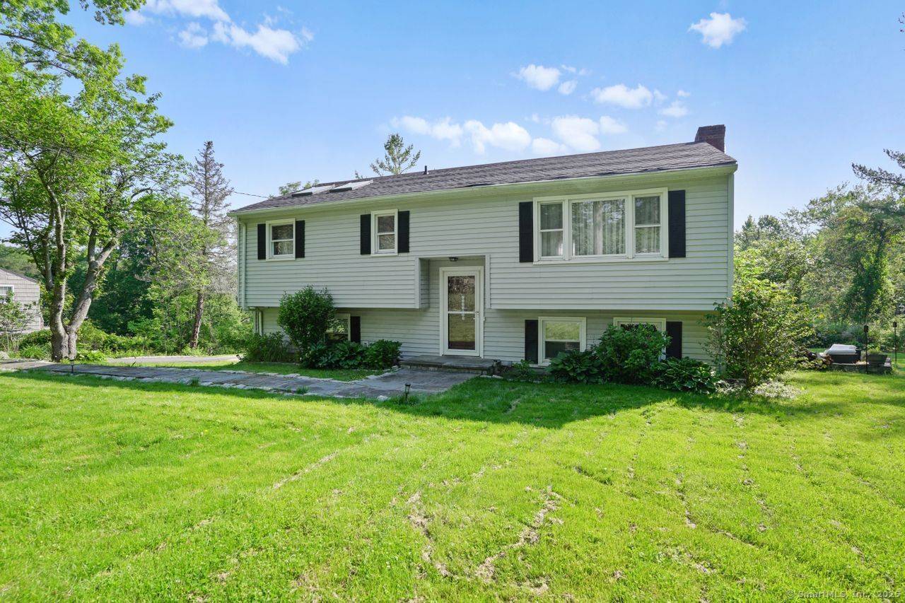Set back from the road behind a classic stone wall, this 1, 800 sq ft raised ranch, built in 1965, offers a versatile layout and a rare opportunity to buy ...