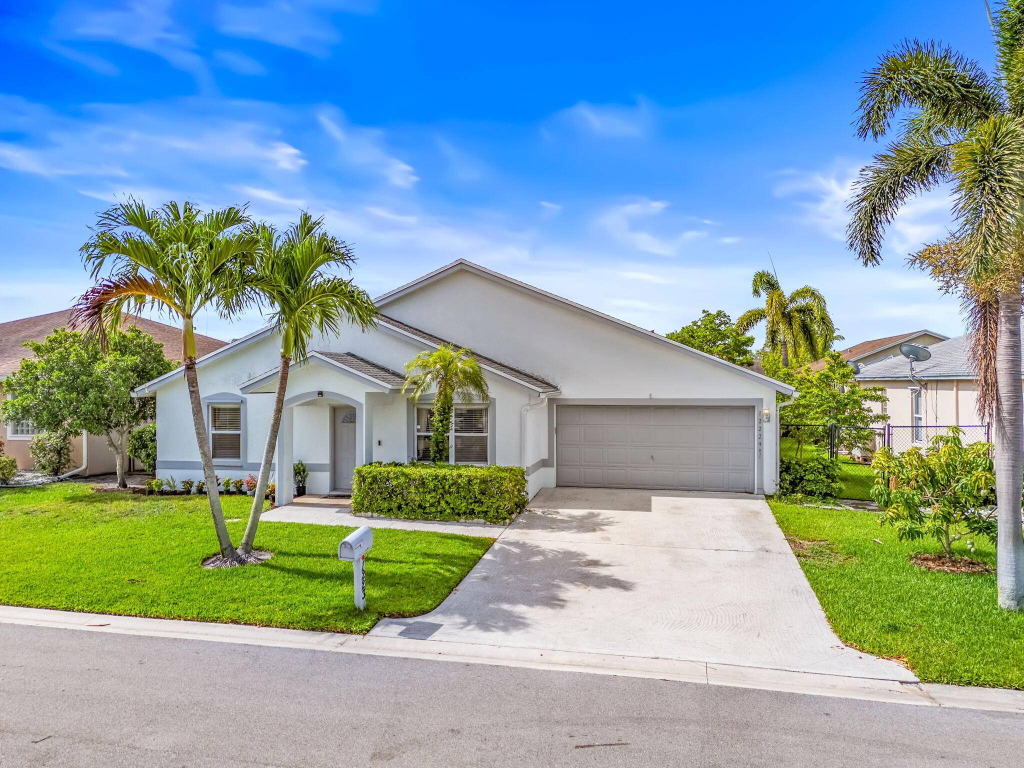 Spacious and meticulously maintained 3 bedroom, 2 bathroom home with a large Florida Room and 2 car garage, located in the desirable gated community of Normandy Isles.