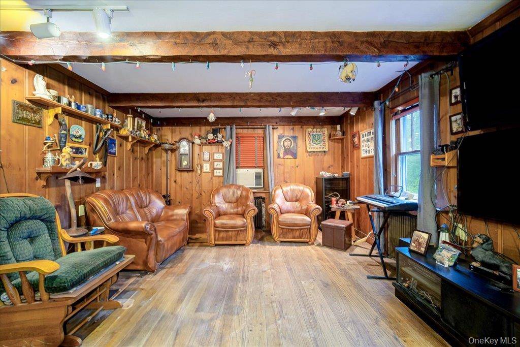 Welcome to 2 Couzines Rd in Woodbourne, NY where handcrafted beauty, privacy, and possibility come together on over 7 acres of serene land.