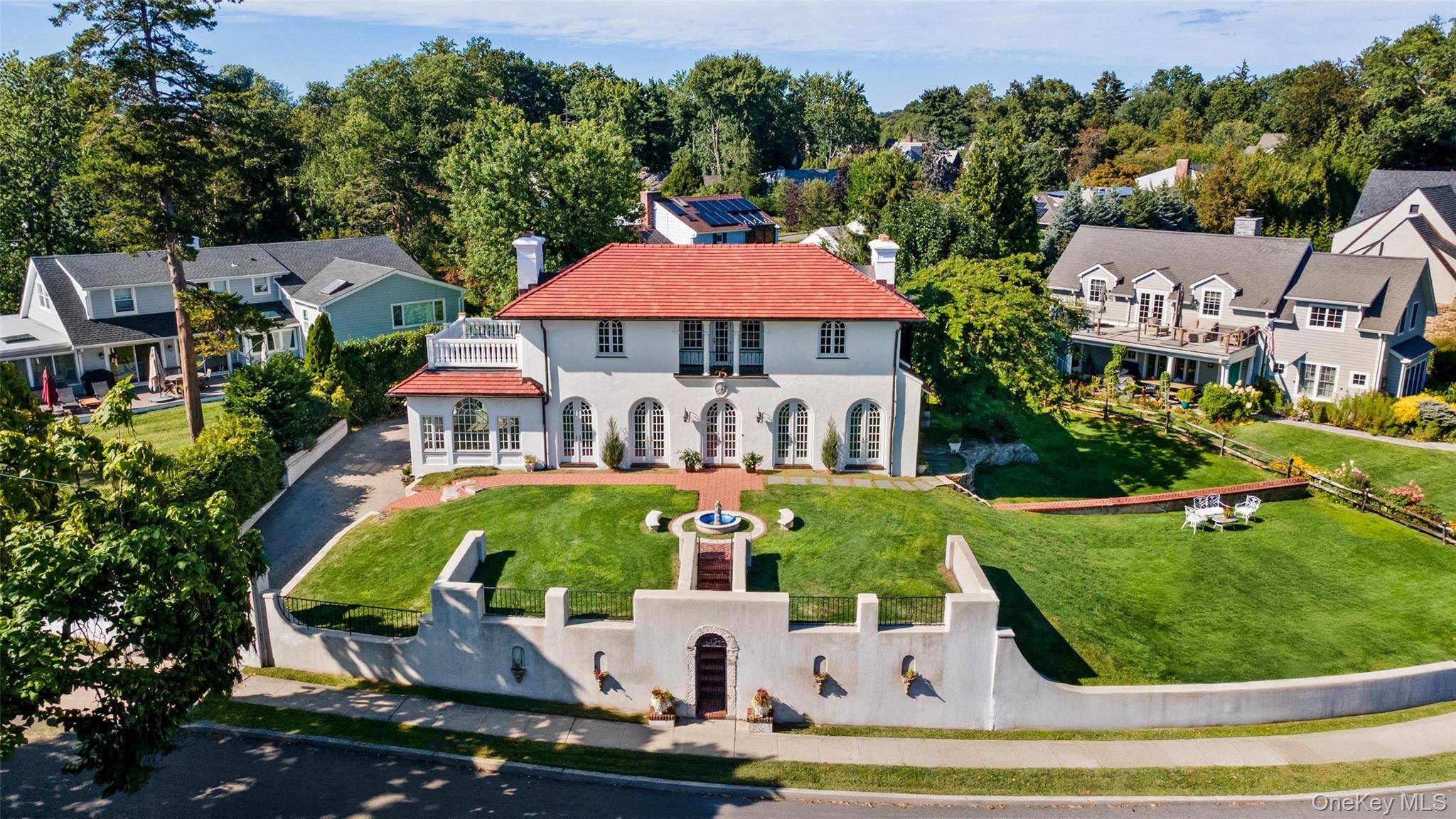 Rare find ! Mediterranean gem overlooking the Sound with piazza, fountains and a storied past.