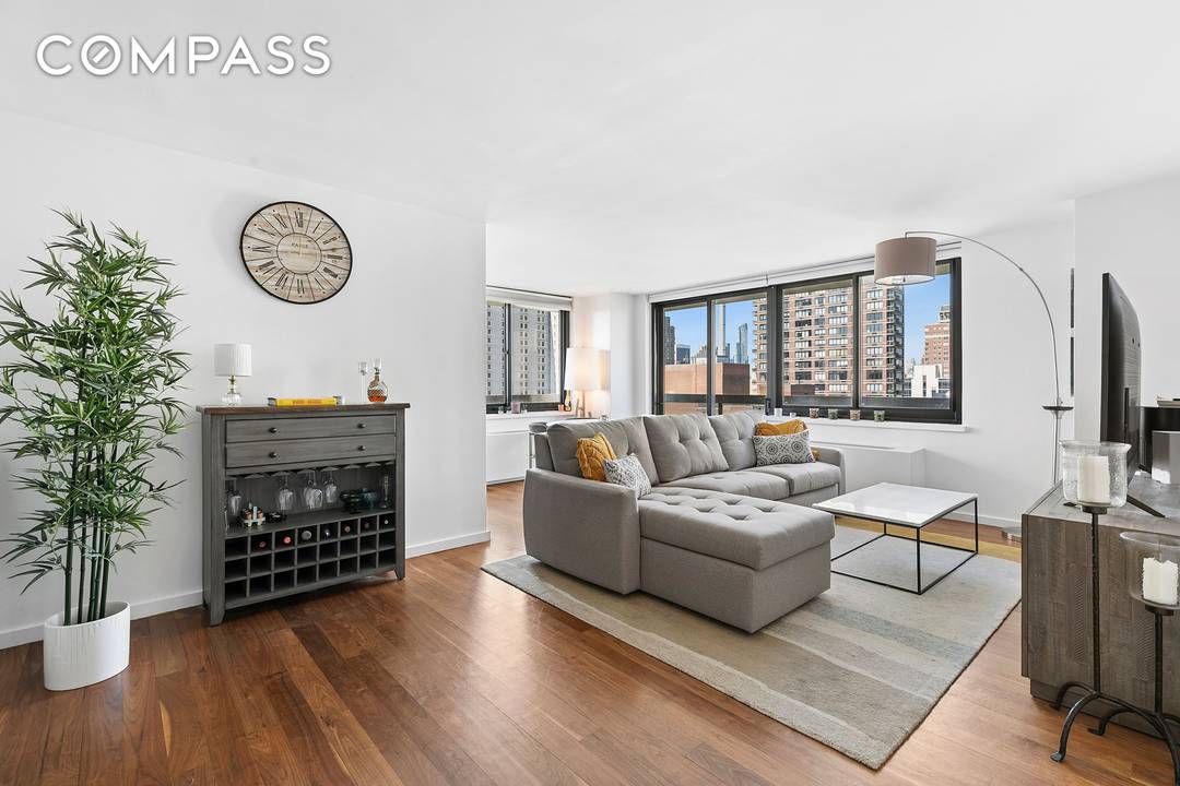 Perched on the 23rd floor, this beautiful corner two bedroom, two bath residence offers sweeping southern and western views, complemented by a private wraparound balcony.