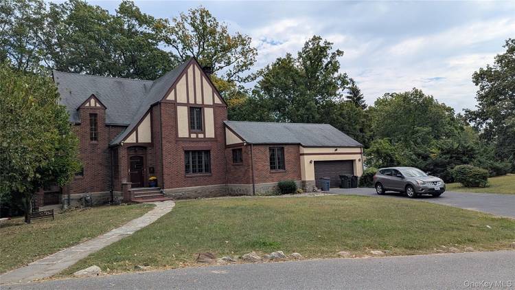 Enjoy this Lovely Furnished or unfurnished Spacious Solid Stone, Brick and Stucco English Tudor Home in a Park Setting Overlooking Roe Pond Park in this Village along The Hudson River.
