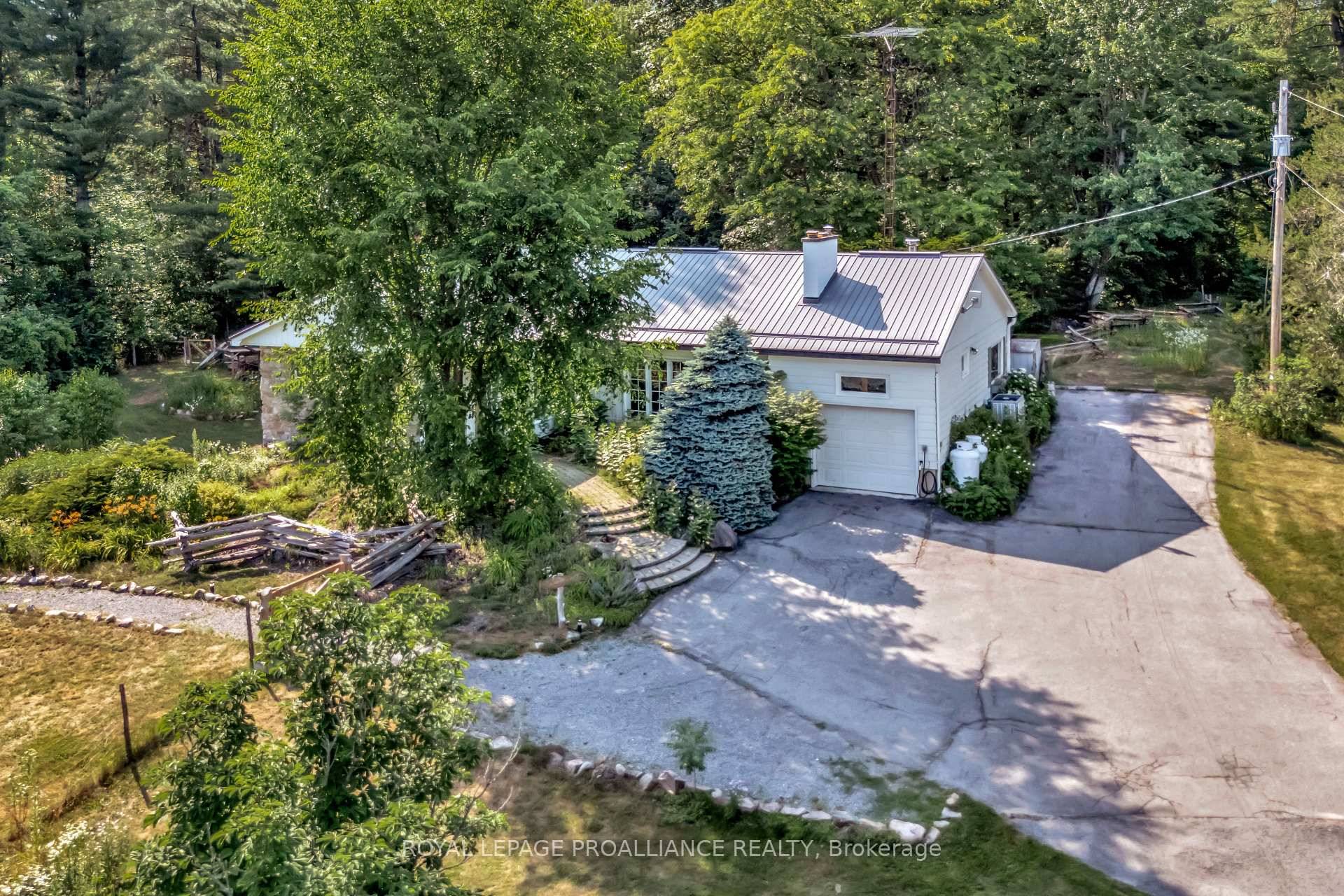 Escape the city and embrace country living with this beautifully updated home a modern oasis with rustic charm.