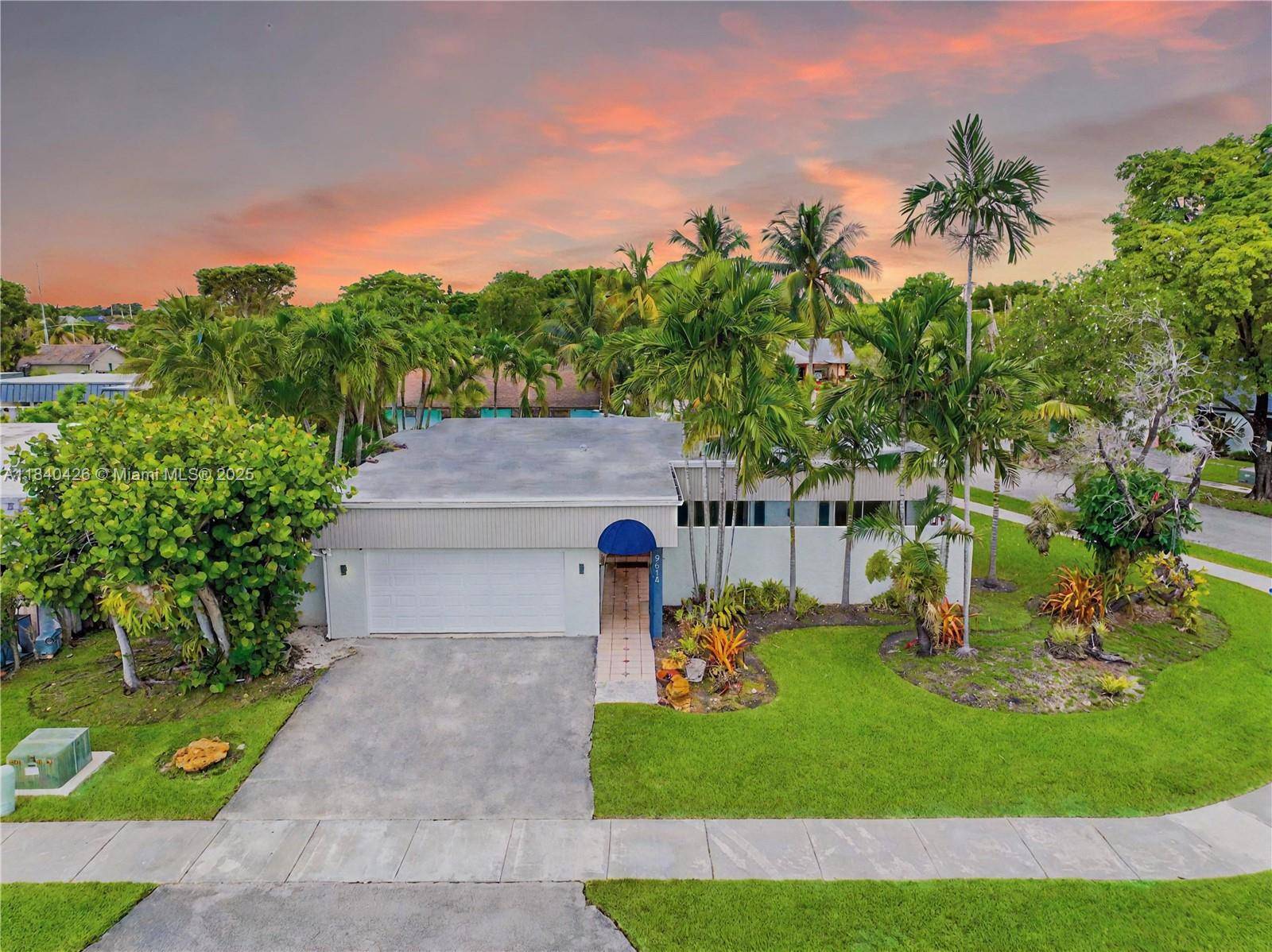 Stunning single family home with a pool on an oversized corner lot in the desirable Calusa neighborhood.