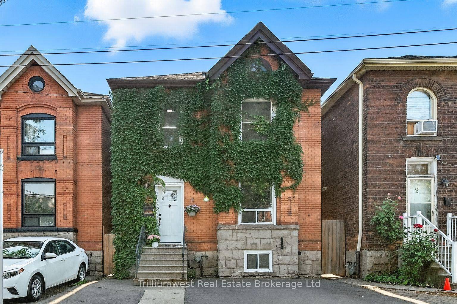 Nestled on a quiet, tree lined street in Hamilton's up and coming neighbourhood, this stately 2 storey red brick home blends historic charm with modern day functionality.