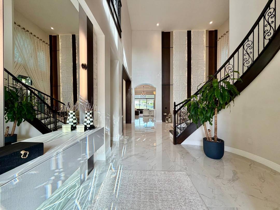 Custom upgrades Vizcaya model lakefront pool home has 4 bedrooms plus Den !