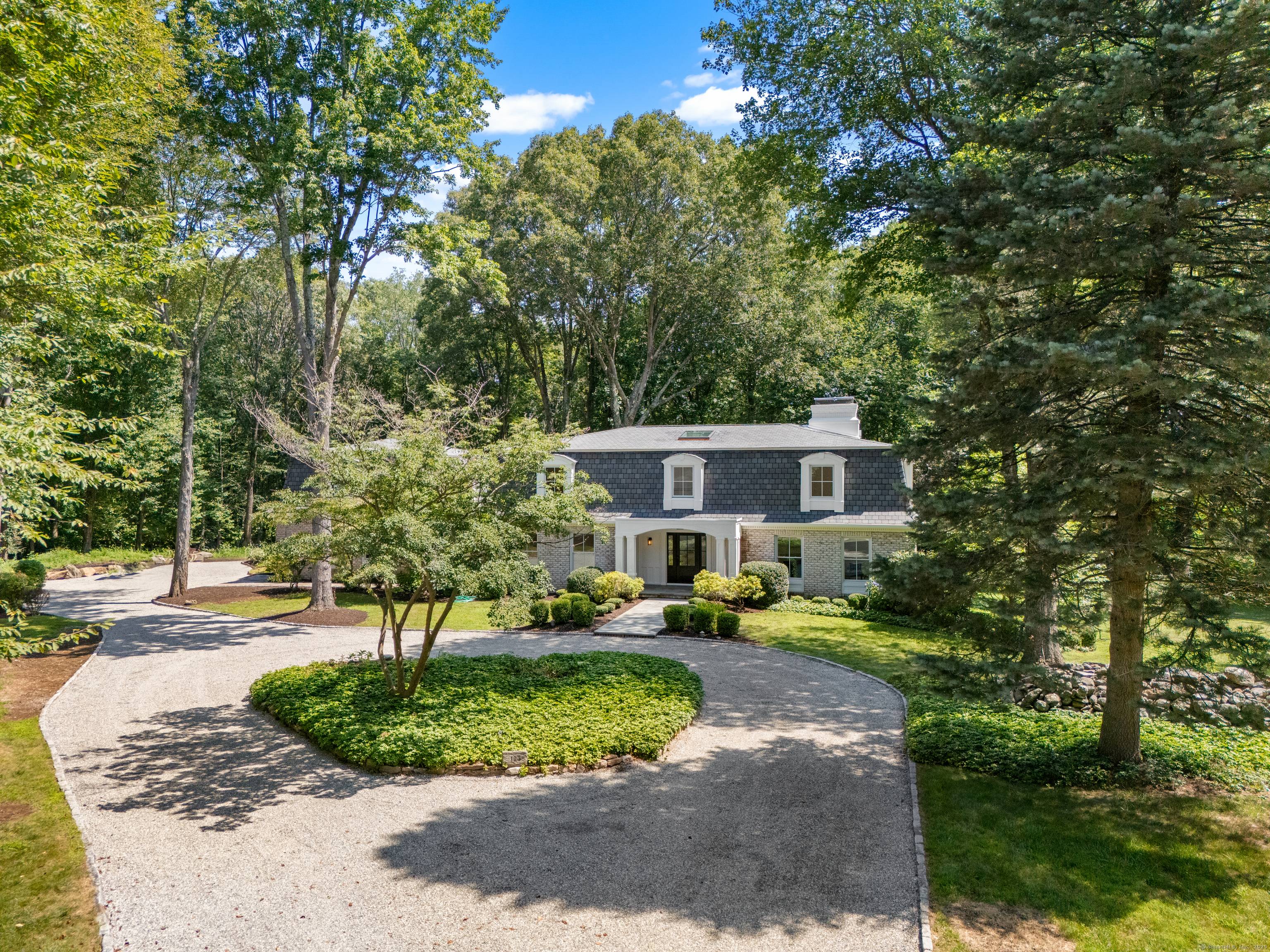 Set on a park like 3 acre level lot this exceptional home blends modern luxury with thoughtful design and quality craftsmanship throughout.