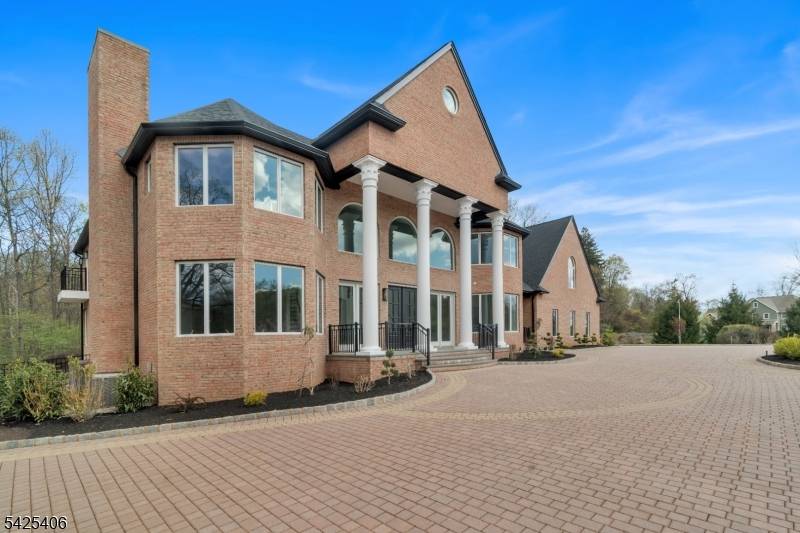 This exceptional custom built estate blends timeless architecture with a refined contemporary aesthetic, offering resort style living on a private cul de sac.