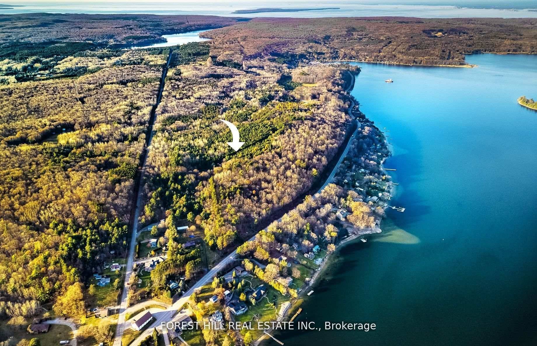 Discover an Exclusive 96 Acre Property with Stunning Lake and Town Views !
