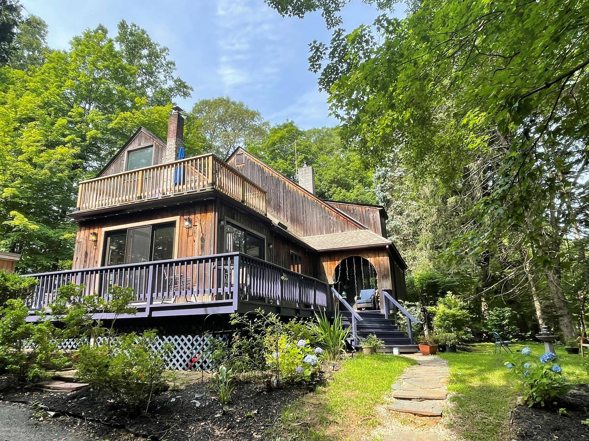Charming chalet set on a beautifully landscaped acre plus in one of the most sought after areas of Croton on Hudson.