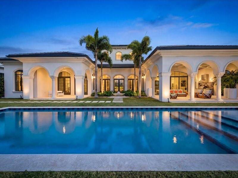 Brand new custom estate in the prestigious Enclave Coral Ridge Country Club in East Ft.