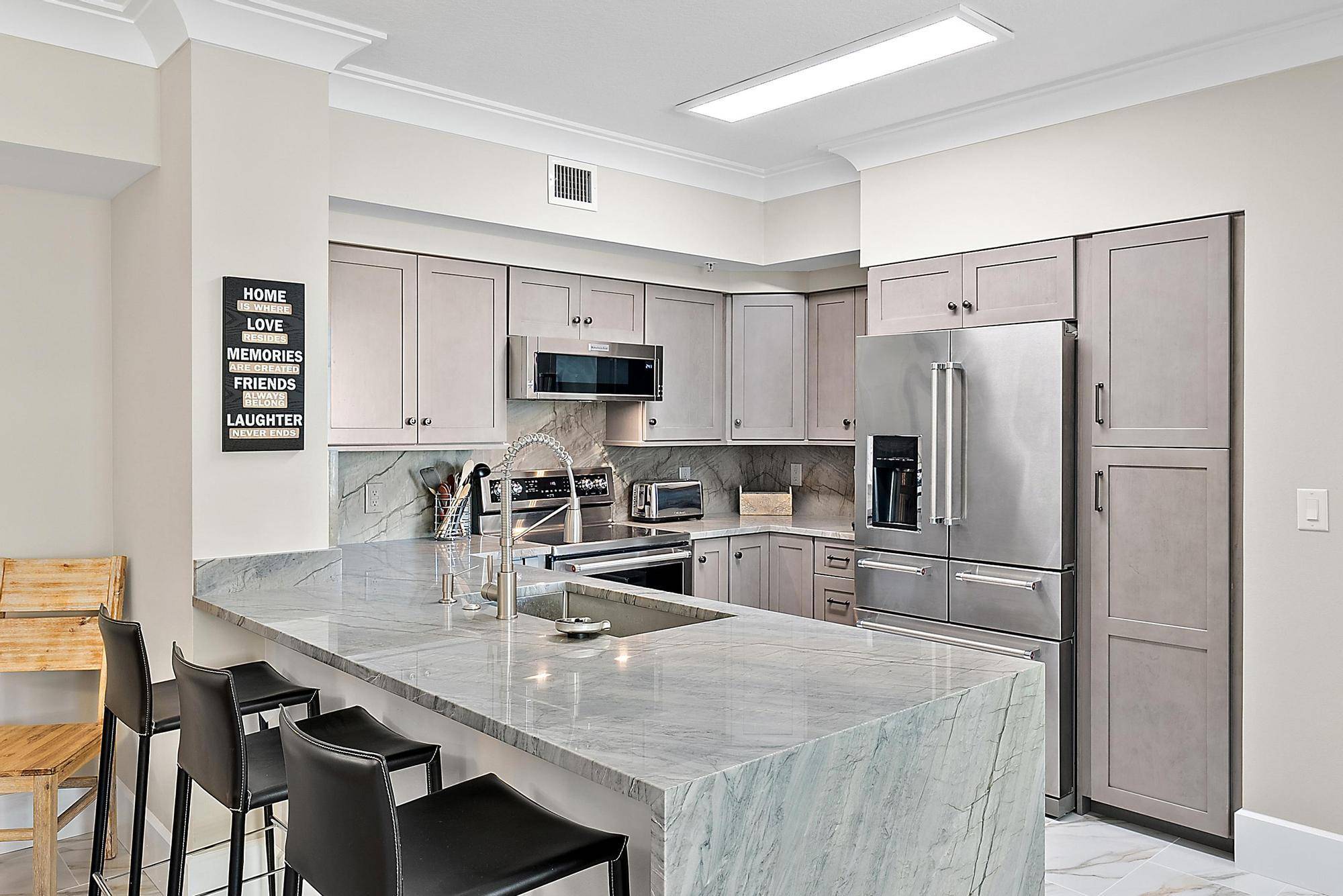 Experience the best of waterfront living in this beautifully updated corner unit located in the highly desirable Marina Village community.