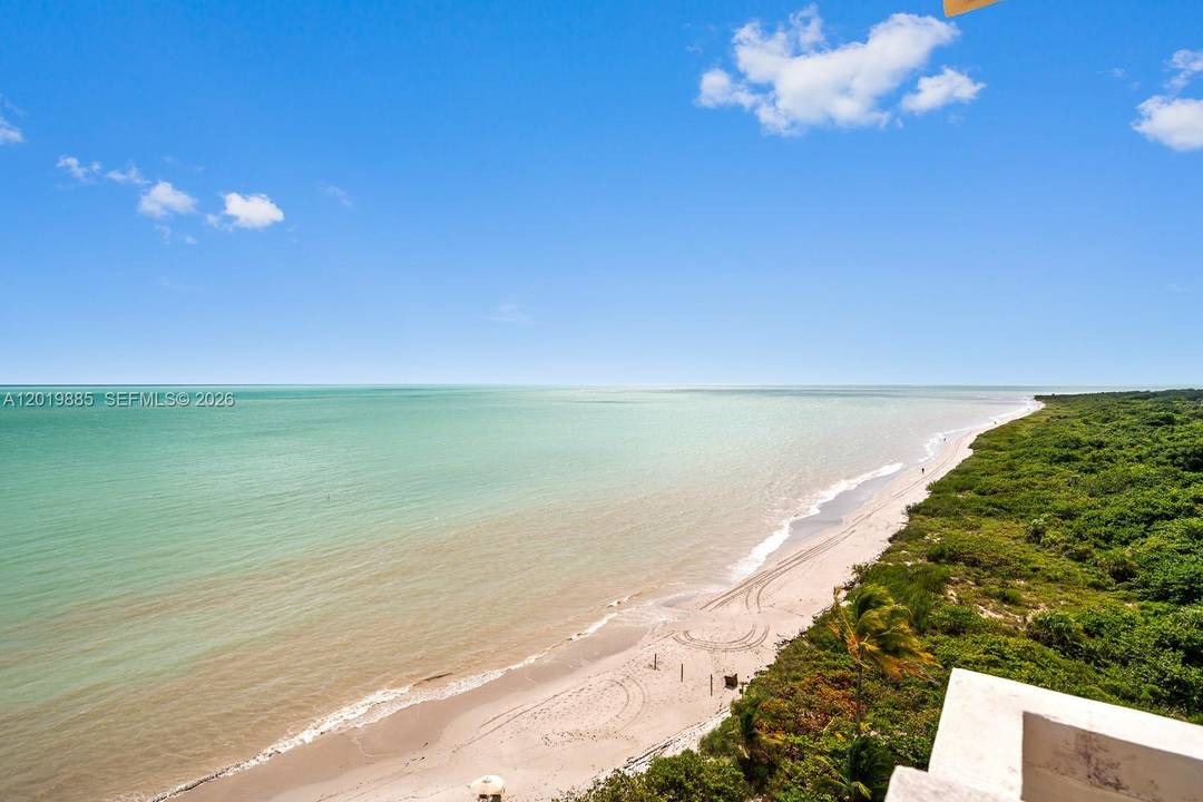 This highly sought after oceanfront corner residence offers an exceptional combination of privacy, light, and breathtaking panoramic views from every window.