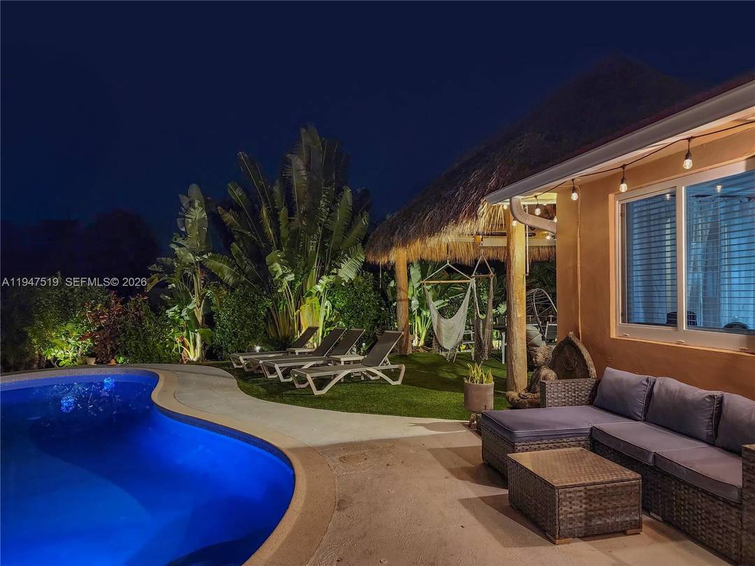 Experience resort style living year round in this exceptional canal front home with impeccable landscaping.