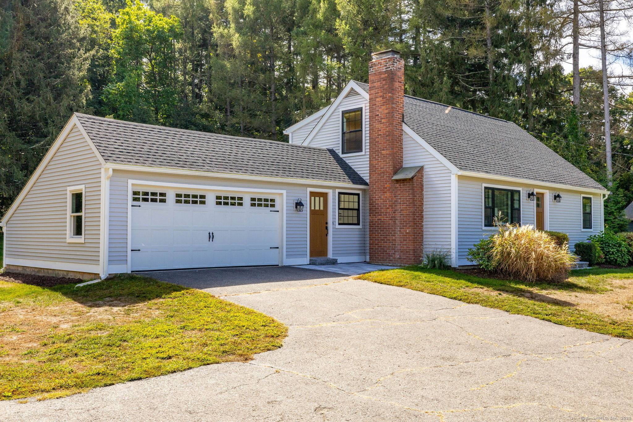 Welcome to this beautifully updated four bedroom, two bath home in the heart of Simsbury, CT !