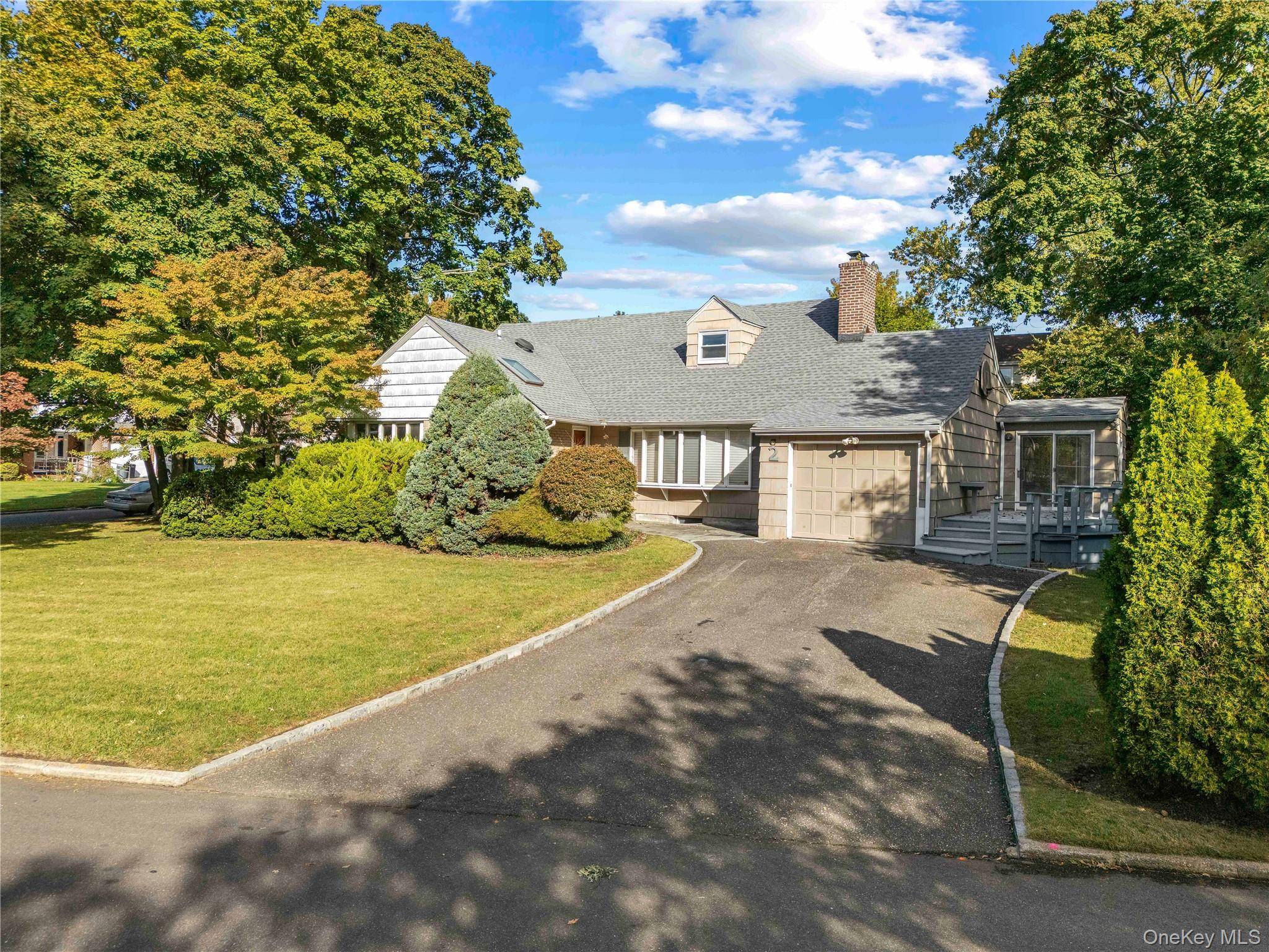 Welcome to 2 Dale Carnegie Court, a beautifully maintained and thoughtfully designed home nestled in Lake Success in Great Neck neighborhoods.
