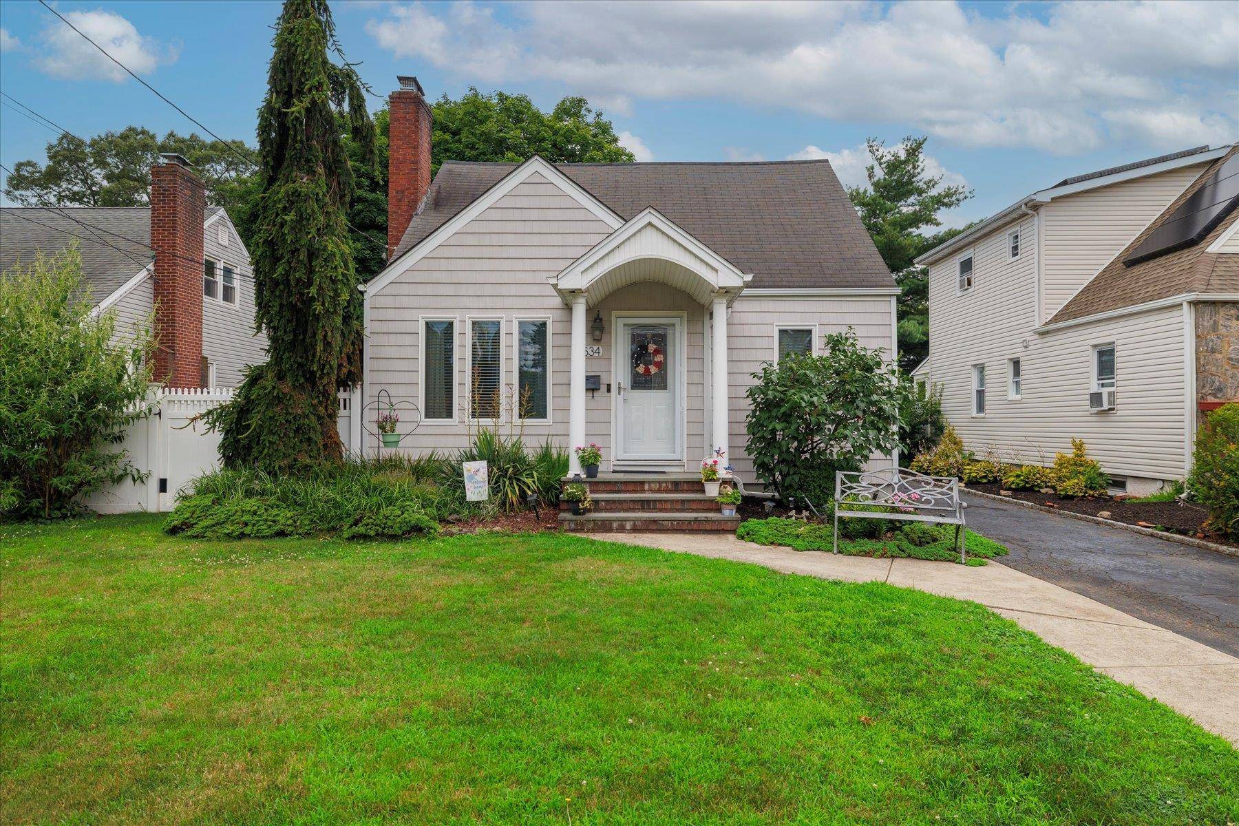 Charming 4 bedroom Cape nestled in a highly desirable neighborhood.