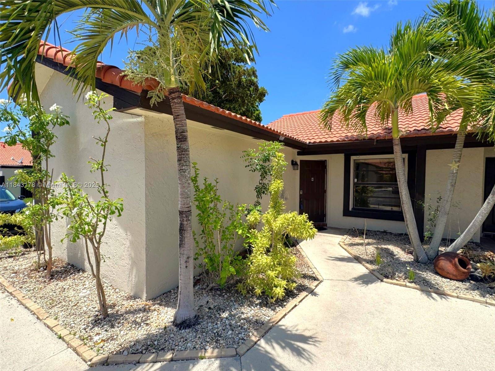 Remodeled 2 2 single story townhome with wood look tile floors and spacious open living area.