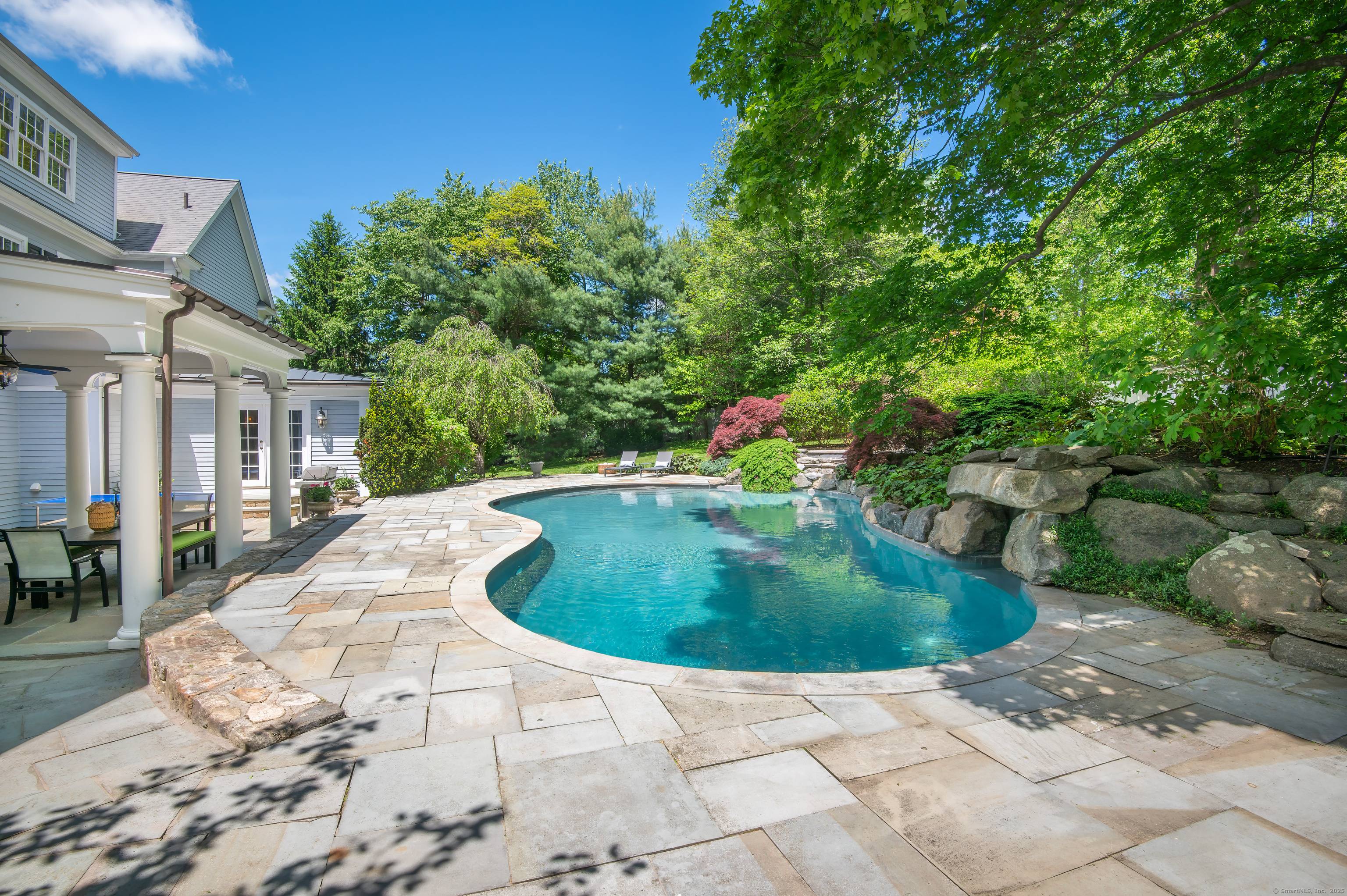 Elegantly situated in one of Fairfield County's most desirable scenic roads, this timeless estate offers luxury and privacy on two acres of park like grounds.