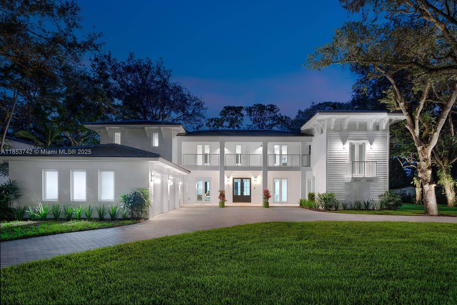 Set on an oversized lot with over 30 majestic oak trees, this timelessly designed home offers serenity in a prime South Miami location.