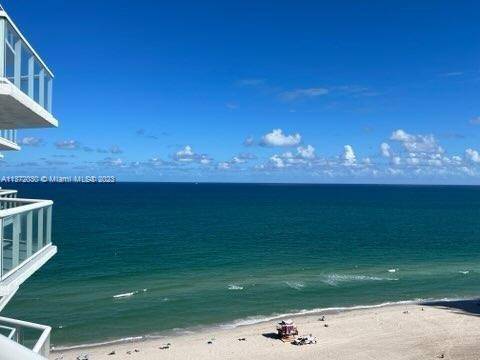 BREATHTAKING ENDLESS PANORAMIC VIEWS OF OCEAN AND CITY FROM THIS BEAUTIFULLY FURNISHED CONDO.