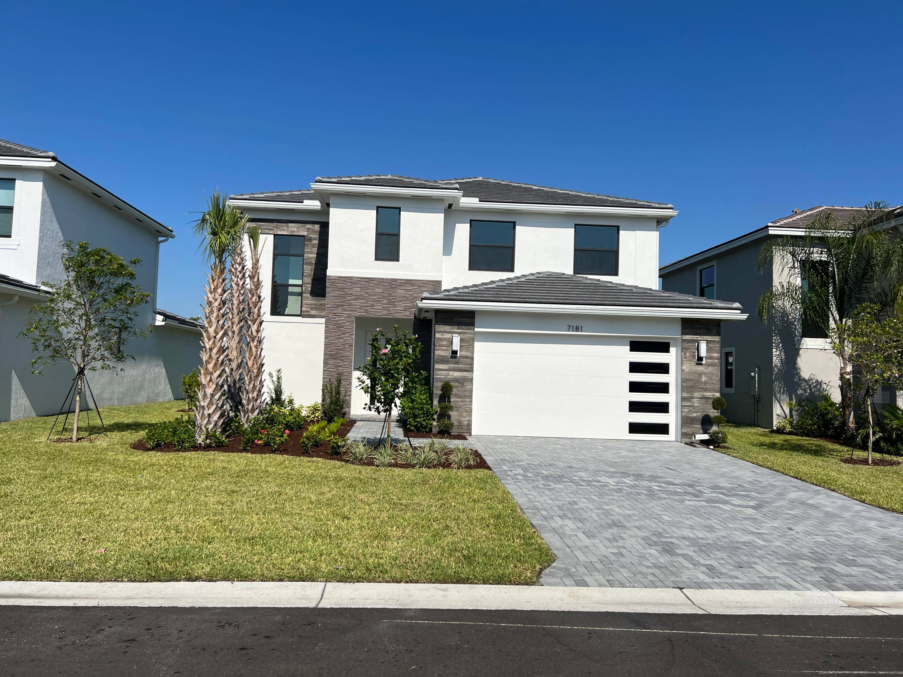Gorgeous modern 4Bed 3Bath with two car garage home on the lake in the Beautiful Gated Villamar at Toscana Isles Community.