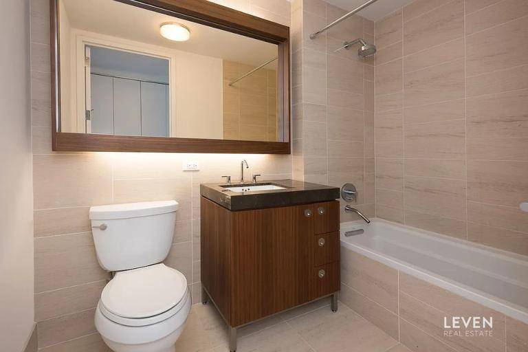 LARGE CORNER STUDIO WITH ADDITIONAL HOME OFFICE SPACE, STORAGE UNIT INCLUDEDIn the Reade57 condominium enjoy an excellent 712sf layout, impressive South Western views to the river and Freedom Tower, beautiful ...