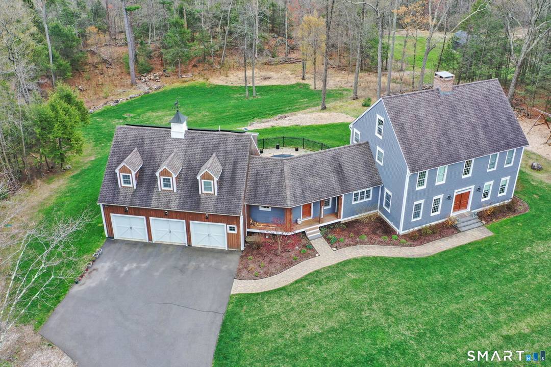Experience the ultimate private sanctuary in this meticulously updated 4 bedroom modern colonial, gracefully set on over four acres of pristine, park like grounds.