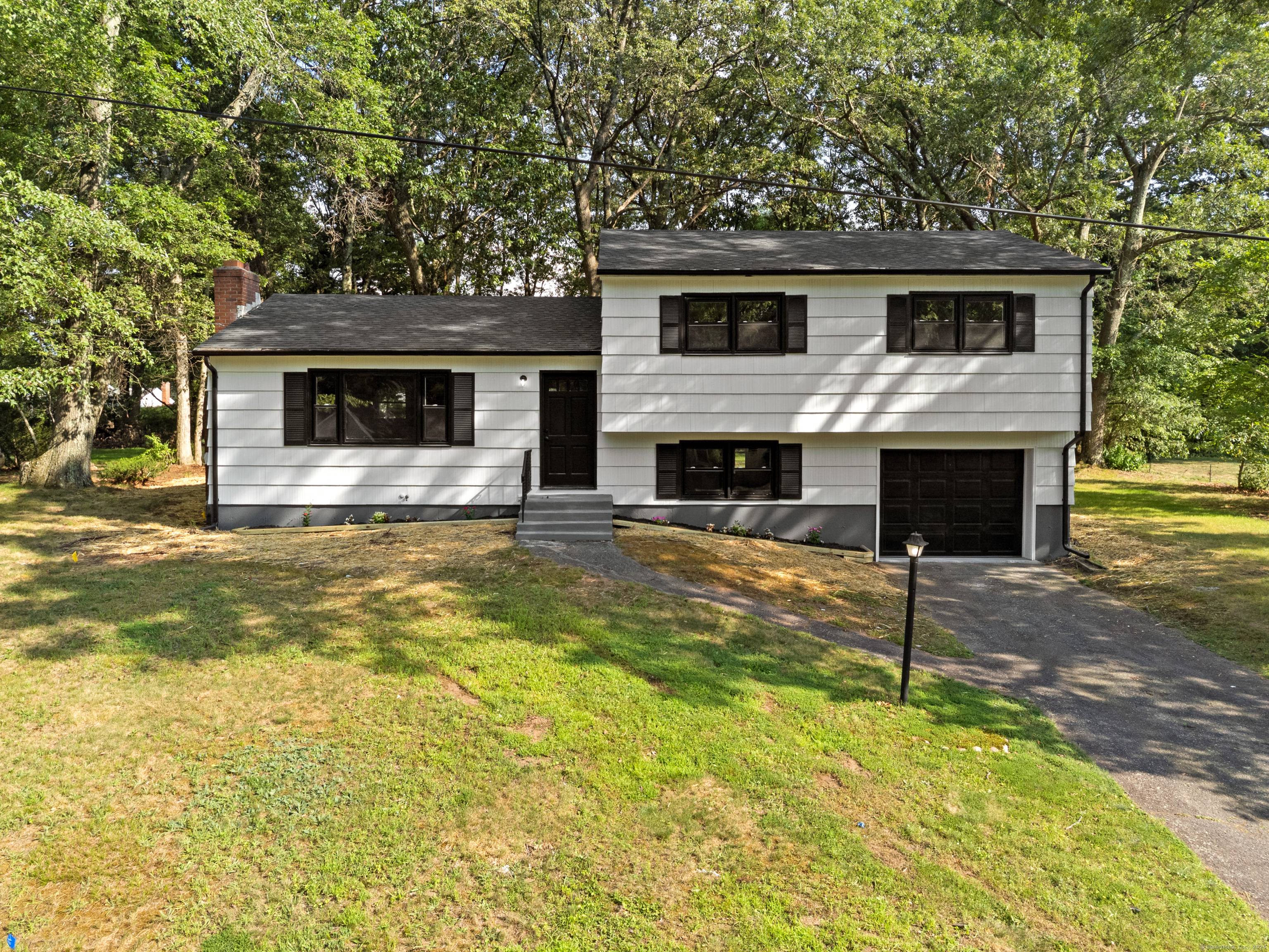 Step inside this beautifully renovated multi level home tucked in a peaceful, tree lined neighborhood.