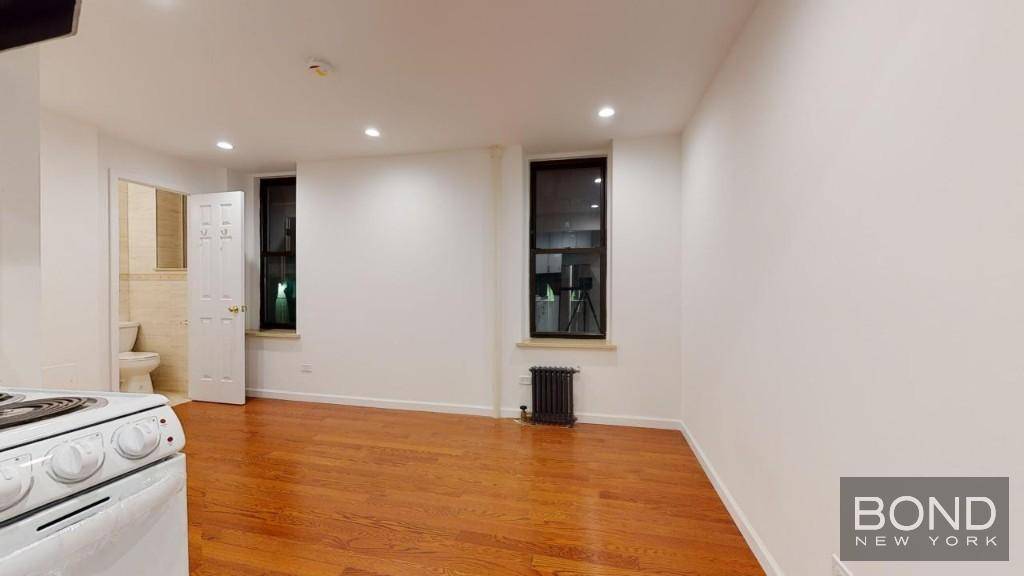 Renovated 2 bedroom apartment with oak floors and a marble bathroom on a very desirable East Village block.