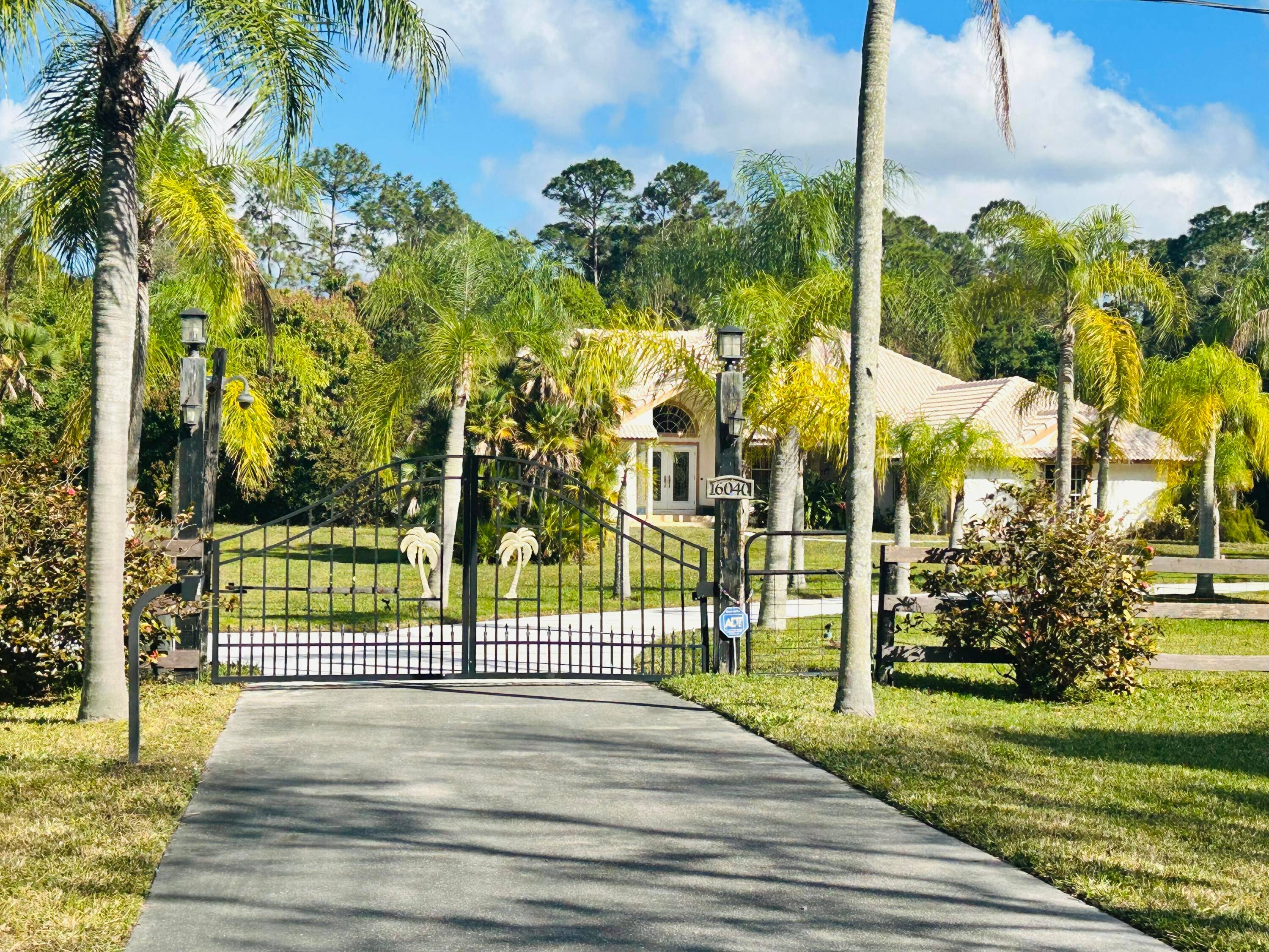 Stunning 4 bed 2. 5 bath gated Jupiter Farms Home on desirable 2.