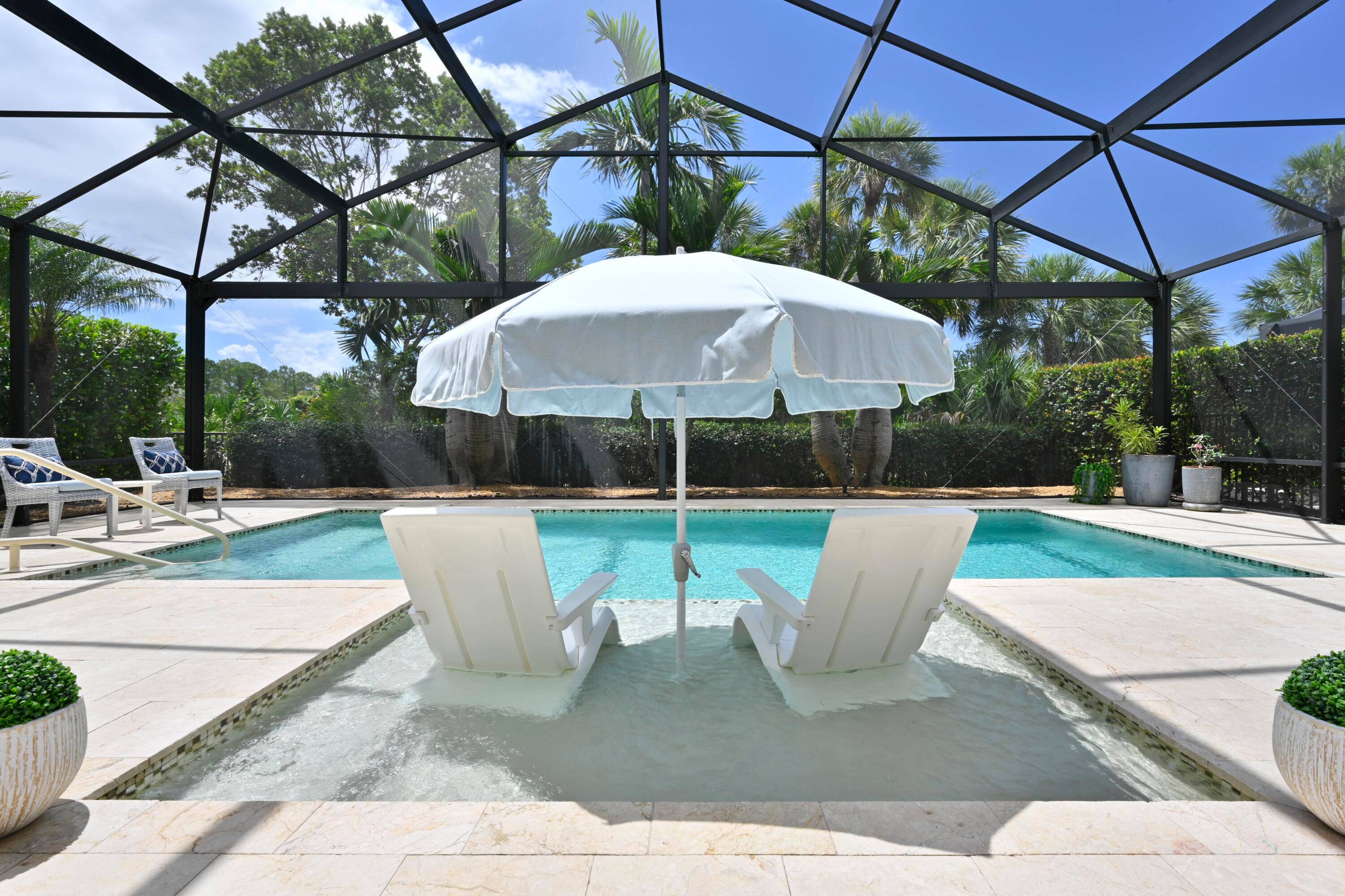 Welcome to this beautifully updated single family residence in the desirable Jupiter Country Club.