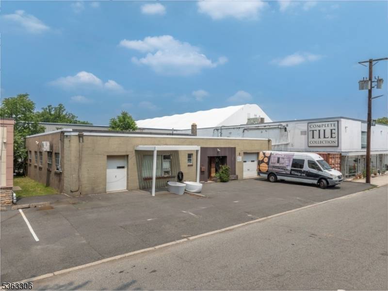 Own a 4, 500 sq. ft building with land on a quiet street.