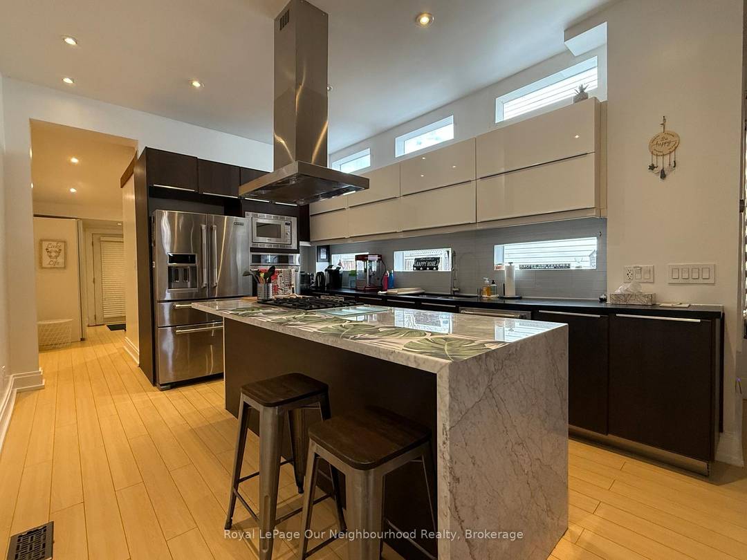 Modern charm meets lakeside living in this beautifully updated three bedroom, two bath semi detached home located in the heart of Mimico.