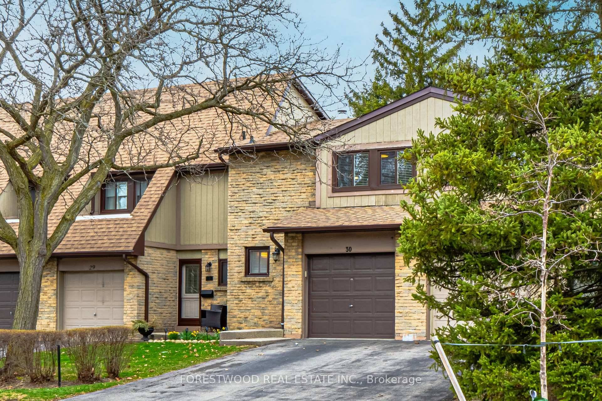 Charming Townhome In The Heart Of Mississauga With Private Backyard And Extra Long Two Car Driveway Features Include Large Open Concept Sunken Living Room With Brick Fireplace And Walk Out ...