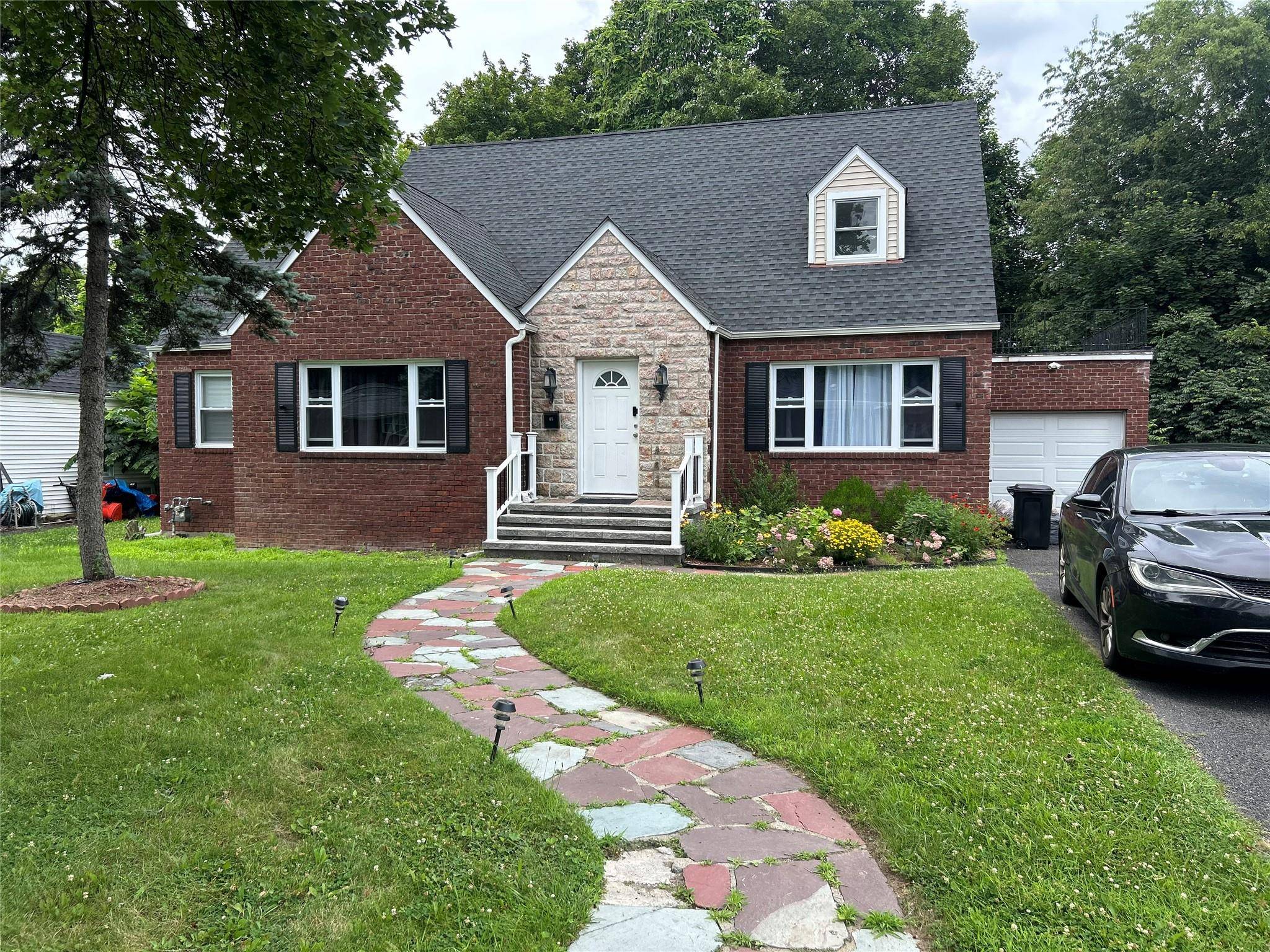 Completely Renovated Tudor Home Stunning Tudor in quiet neighborhood with extensive renovations throughout.