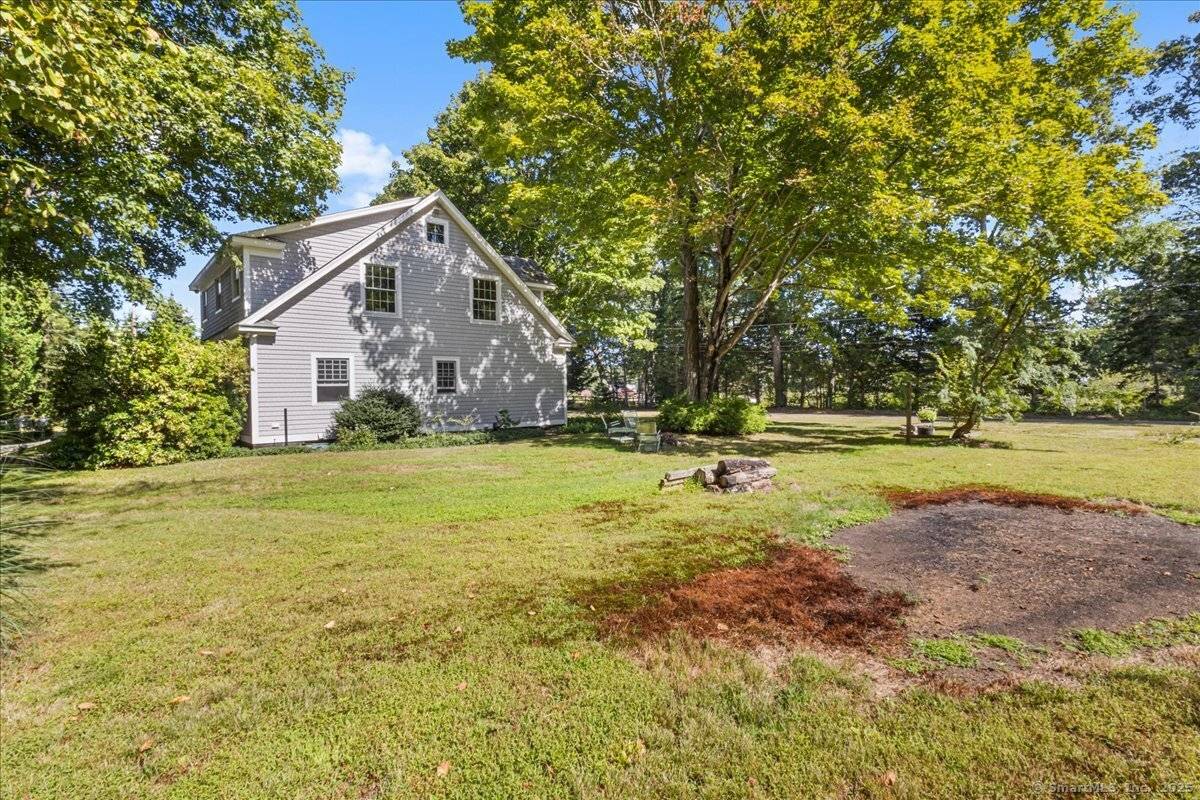 Charming Cape Cod home offering desirable first floor living, nestled on a scenic, spacious, and private lot in scenic Deep River.