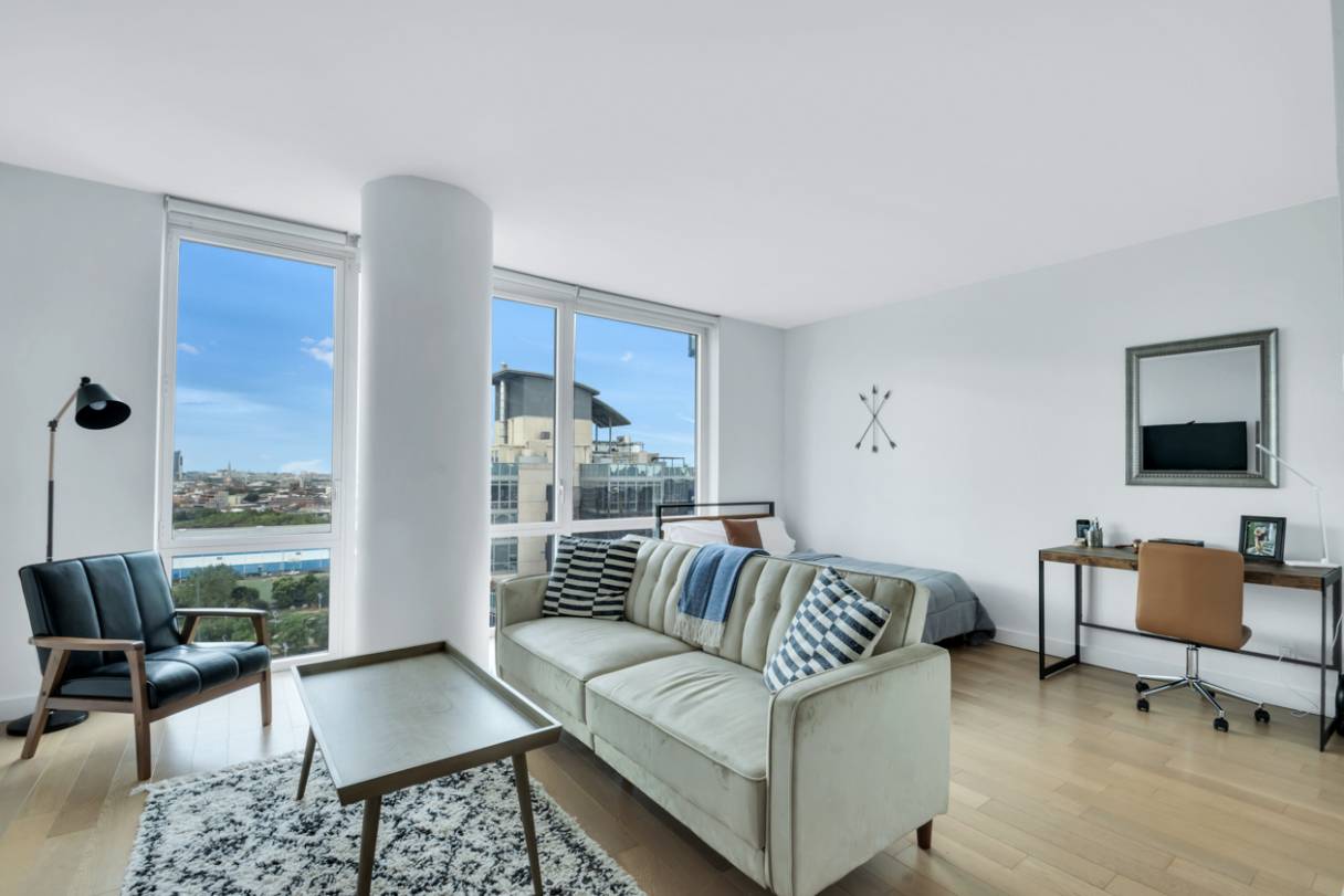 Now available in Williamsburg's premier 24 hour full service doorman building, this spacious and bright luxury studio apartment with amazing views of Manhattan and the East River features state of ...