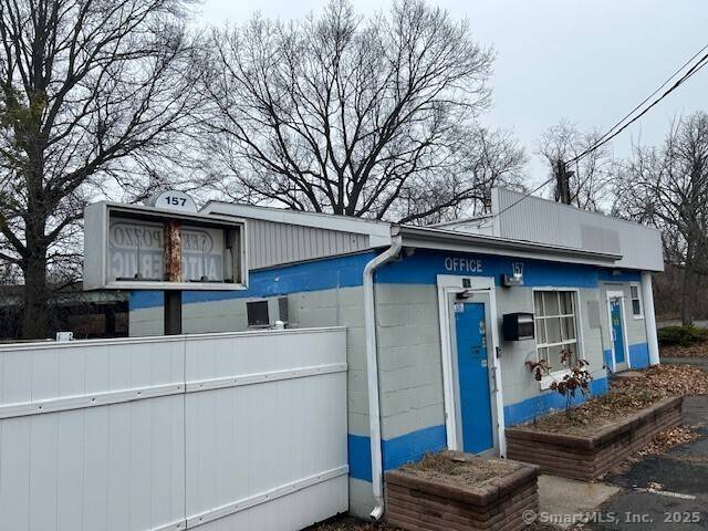 Great opportunity to purchase this near half acre property with an existing 2052 sq foot building on it.