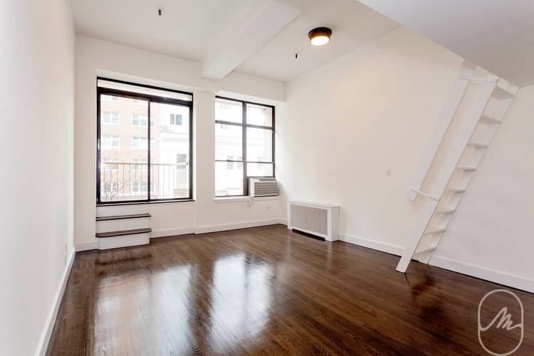 Amazing views, high ceilings, balcony, and storage loft in this gorgeous lofty studio !