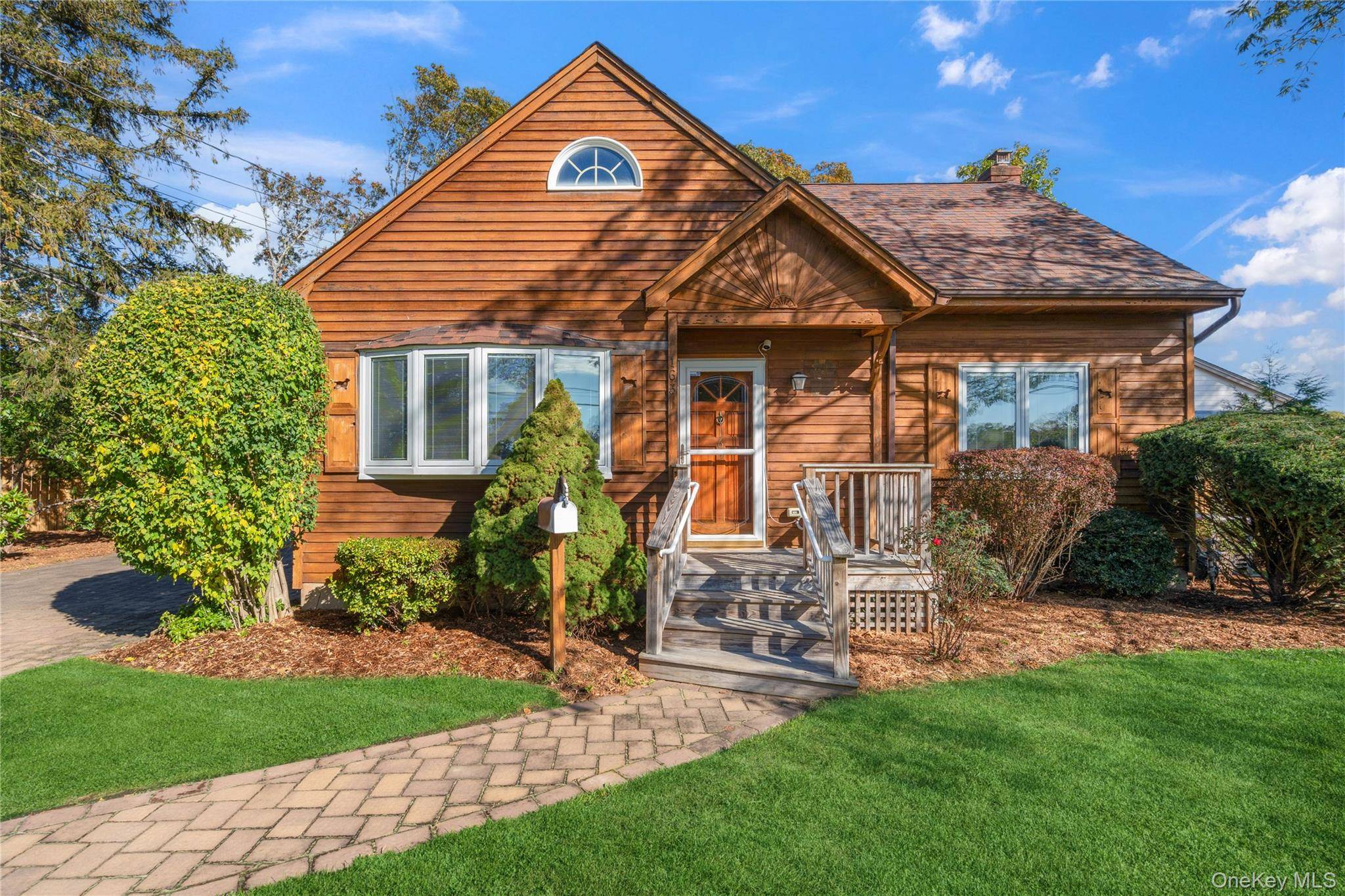 Expandable Ranch with 2 full bathrooms and room to grow, beautifully maintained, set on a quiet, tree lined street in the heart of Bayport.