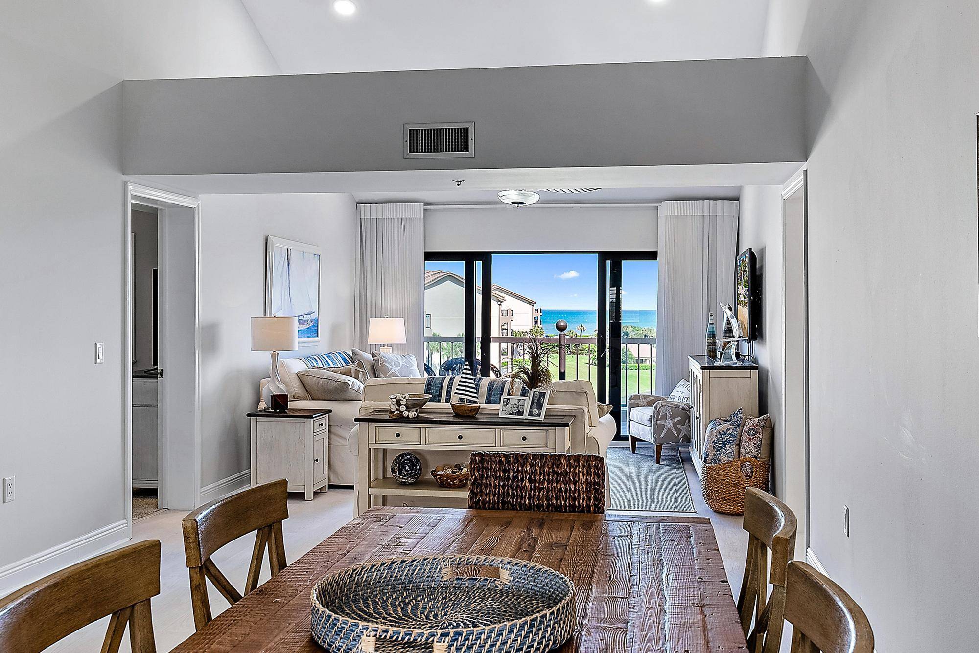 Breathe in the sparkling, Bahama blue, ocean views from this stunning penthouse with soaring, 20 foot cathedral ceilings.