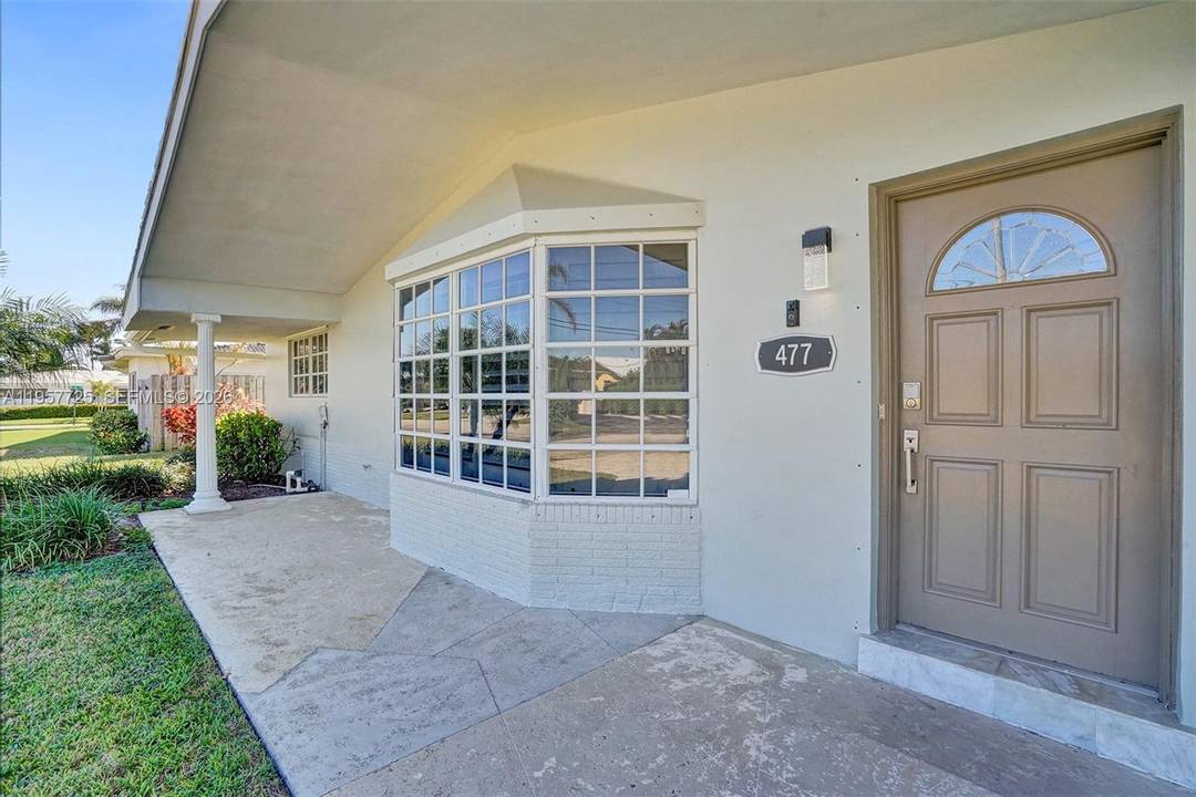 tunning 4 bedroom, 3 bathroom home located just west of the Intracoastal in the highly desirable Cove neighborhood of East Deerfield Beach.