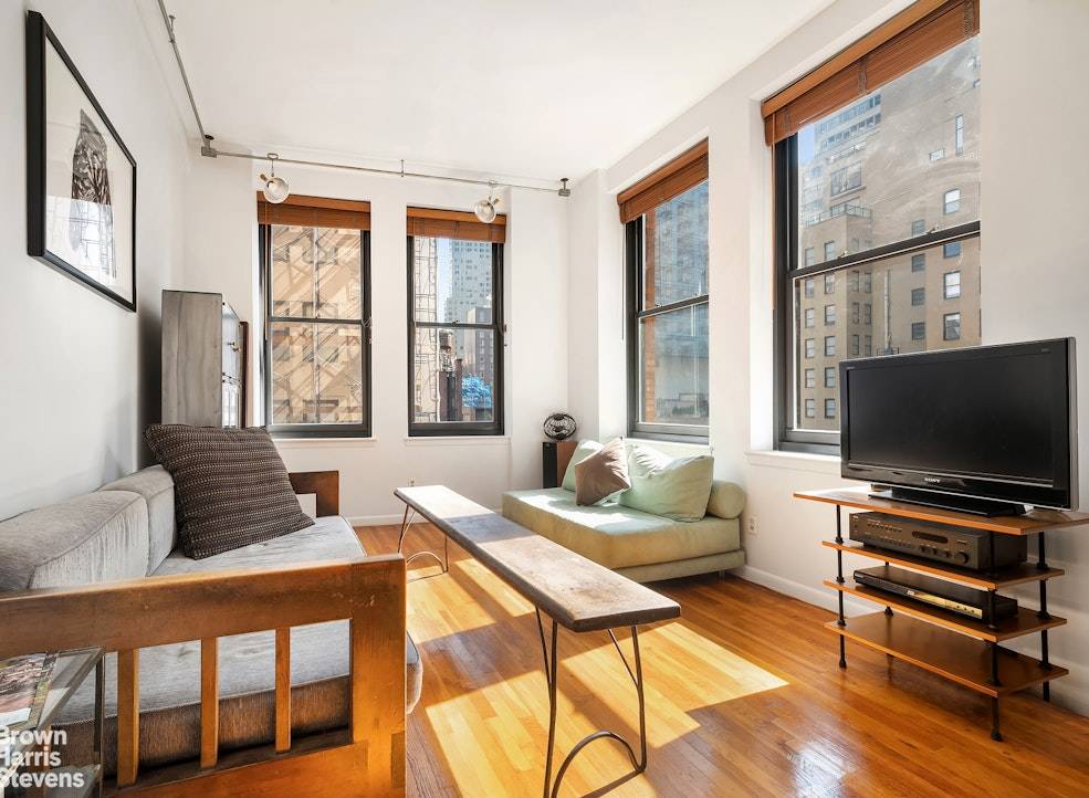 Welcome to this stunning corner loft apartment, where historic charm meets contemporary comfort.