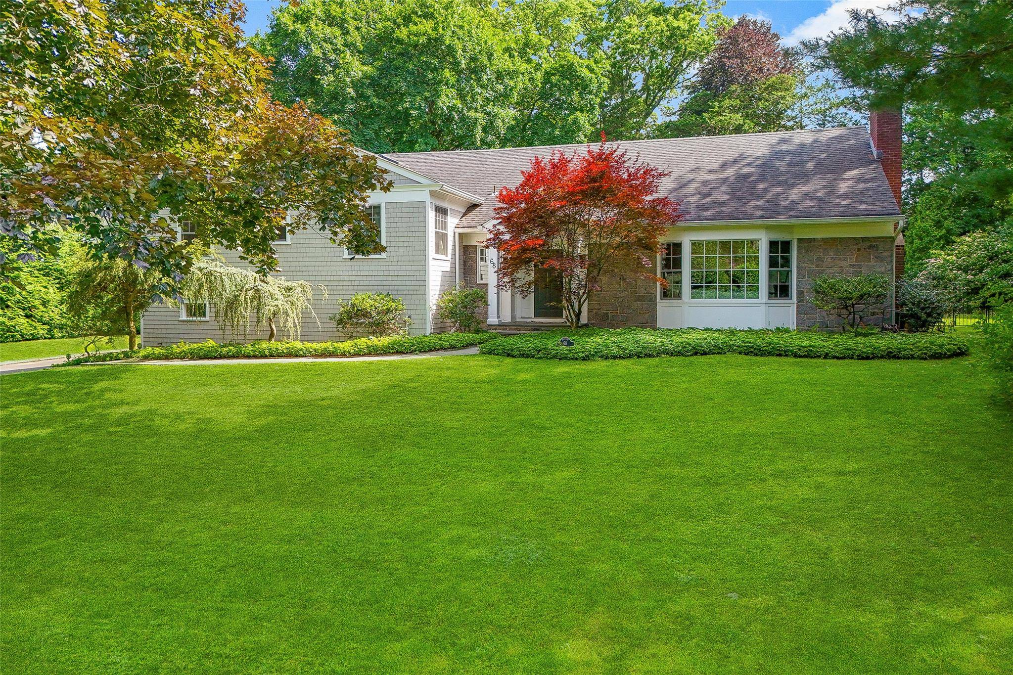 Discover the epitome of luxury and comfort in this stunning 5 bedroom, 3 1 2 bathroom residence, nestled in the prestigious community of Rye, New York.