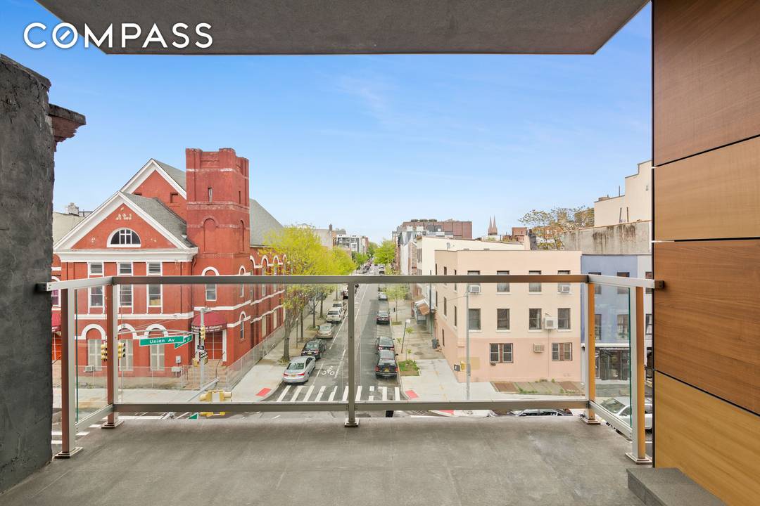 Floor to ceiling windows, a private balcony, and an open concept layout sets the tone for Unit 4 at 261 Union Avenue a two bedroom, two bathroom condominium offering 885 ...