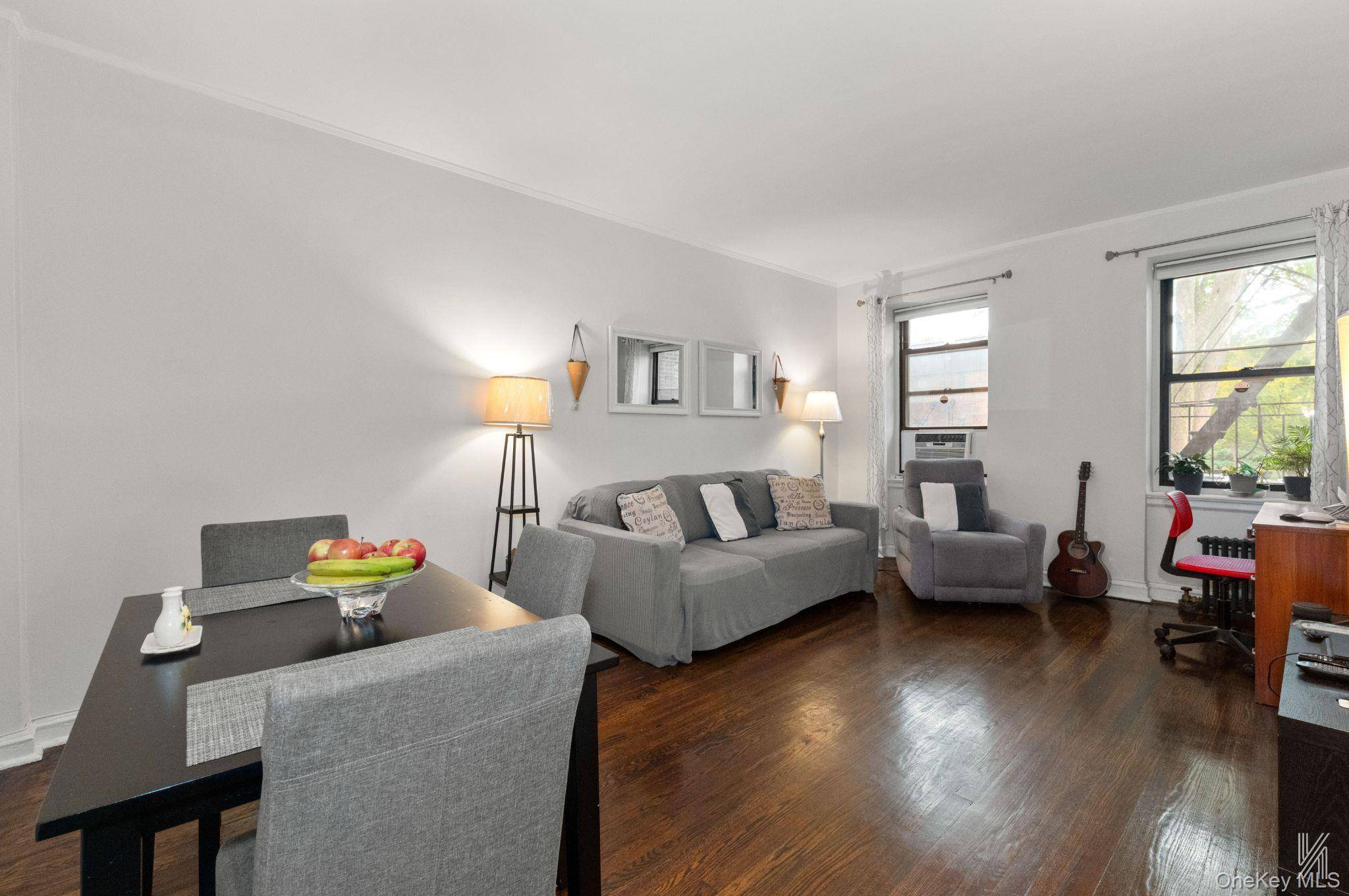 Located in Astoria Heights, this impressive second floor unit features clean white walls and subtly arched entryways.